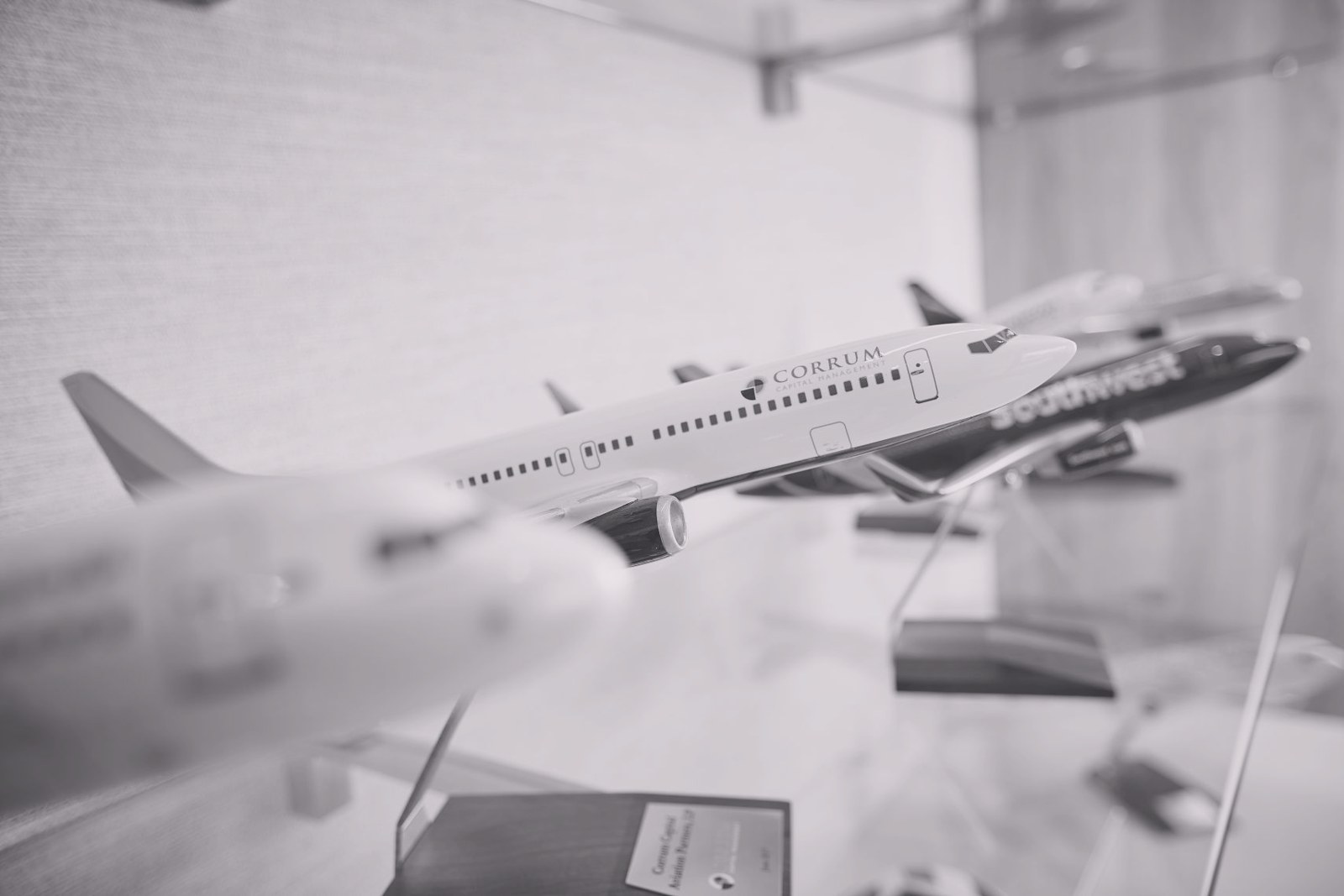 A Corrum-liveried aircraft model on display