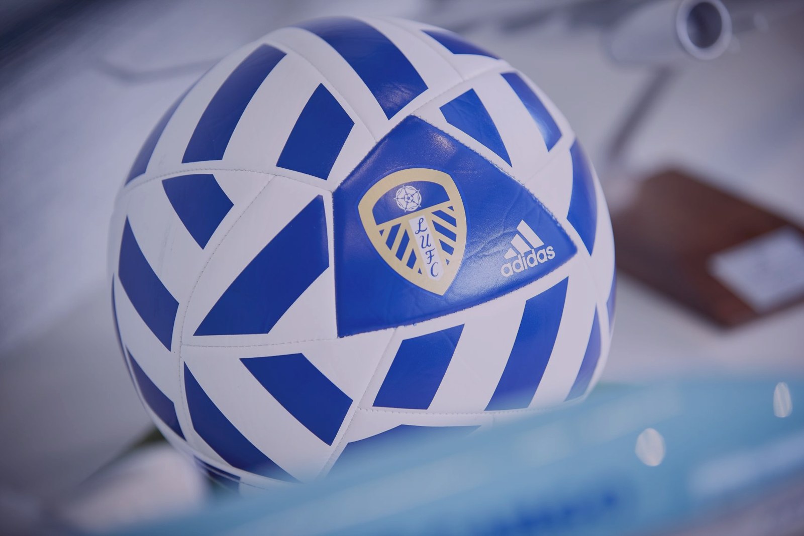 A football on a desk in the Charlotte office